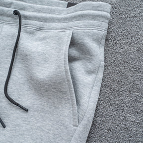 Calça NK Tech Fleece Cinza